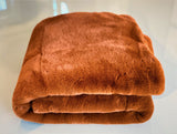 Experience luxury redefined with ONE Preevay's Faux Rabbit Fur Throw in Coco Brown. Inspired by Fernando Botero and crafted from Ultra Premium Faux Rabbit Fur. Hypoallergenic, cruelty-free, and lined with elegant velvet for refined warmth and sophistication. 800gsm, 50x60 inches