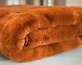 Experience luxury redefined with ONE Preevay's Faux Rabbit Fur Throw in Coco Brown. Inspired by Fernando Botero and crafted from Ultra Premium Faux Rabbit Fur. Hypoallergenic, cruelty-free, and lined with elegant velvet for refined warmth and sophistication. 800gsm, 50x60 inches.