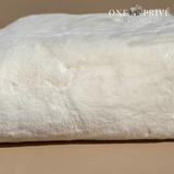 the One Preevay Faux Rabbit Fur Throw in Pure White. Inspired by the elegance of Fernando Botero and crafted from ultra-premium faux rabbit fur. Hypoallergenic, cruelty-free, over the sofa...