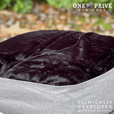 Experience luxurious relaxation with the One Preevay Luxury Home Furnishings, world's first weighted faux rabbit fur blanket, inspired by Fernando Botero. Clinically developed, 20lbs, queen size, and hypoallergenic. Perfect for a serene sleep black color