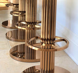 Discover the Atlas Bar Stool by One Preevay, inspired by the Chrysler Building. Customizable with textured bronze metal and plush velvet. Perfect for luxury residences and upscale spaces close up base 