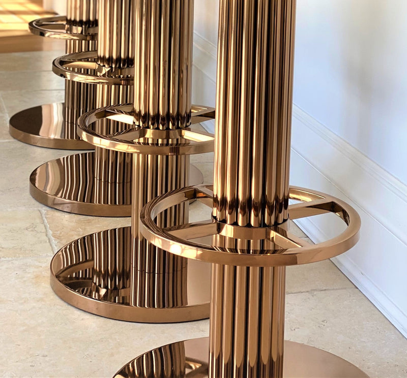 Discover the Atlas Bar Stool by One Preevay, inspired by the Chrysler Building. Customizable with textured bronze metal and plush velvet. Perfect for luxury residences and upscale spaces close up base 