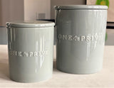 Discover the Moroccan Amber Perfumed Estate Candle from One Preevay. Handcrafted with essential oils and soy wax, this 21.2 oz candle features a triple wick and pale gray porcelain vessel. Enjoy the blend of sweet patchouli, heliotrope