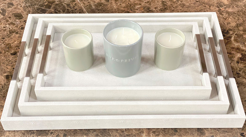 Discover the Thursby Shagreen Hotel Tray from One Preevay—a luxurious serving tray crafted with exotic embossed leather and nickel hardware. Available in three sizes: 17"x10", 20"x13", and 23"x15". entertaining experience with sophistication and style. Order now.
