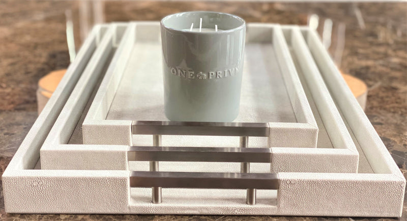 Discover the Thursby Shagreen Hotel Tray from One Preevay—a luxurious serving tray crafted with exotic embossed leather and nickel hardware. Available in three sizes: 17"x10", 20"x13", and 23"x15". Elevate your entertaining experience with sophistication and style. Order now.....
