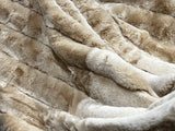 Ribbed Faux Rabbit & Velvet Blanket Collection by One Preevay Luxury Home Furnishings & Decor. Inspired by the regal Robe Royal, each hand-stitched piece features premium cruelty-free faux rabbit fur with elegant velvet underside, available in four luxurious colors: Elegant Black, Warm Beige, Classic Navy, and Dramatic Gray. Sizes: Twin (60" x 90"), Queen (90" x 90"). Hypoallergenic, soothing ribbed design for relaxation and easy care. Cruelty-free luxury, unmatched craftsmanship and detail beige.