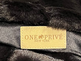 Ribbed Faux Rabbit & Velvet Blanket Collection by One Preevay Luxury Home Furnishings & Decor. Inspired by the regal Robe Royal, each hand-stitched piece features premium cruelty-free faux rabbit fur with elegant velvet underside, available in four luxurious colors: Elegant Black, Warm Beige, Classic Navy, and Dramatic Gray. Sizes: Twin (60" x 90"), Queen (90" x 90"). Hypoallergenic, soothing ribbed design for relaxation and easy care. Cruelty-free luxury, unmatched craftsmanship and detail in black....
