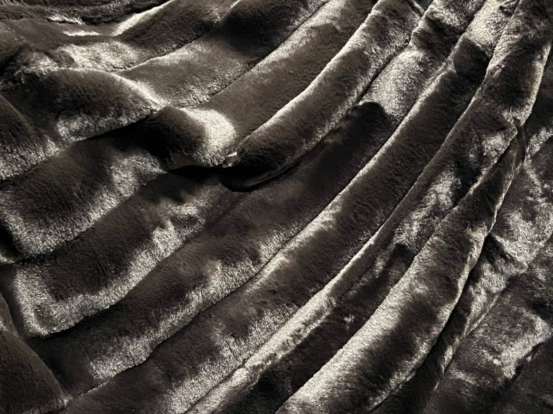 Ribbed Faux Rabbit & Velvet Blanket Collection by One Preevay Luxury Home Furnishings & Decor. Inspired by the regal Robe Royal, each hand-stitched piece features premium cruelty-free faux rabbit fur with elegant velvet underside, available in four luxurious colors: Elegant Black, Warm Beige, Classic Navy, and Dramatic Gray. Sizes: Twin (60" x 90"), Queen (90" x 90"). Hypoallergenic, soothing ribbed design for relaxation and easy care. Cruelty-free luxury, unmatched craftsmanship and detail in black...