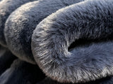 Ribbed Faux Rabbit & Velvet Blanket Collection by One Preevay Luxury Home Furnishings & Decor. Inspired by the regal Robe Royal, each hand-stitched piece features premium cruelty-free faux rabbit fur with elegant velvet underside, available in four luxurious colors: Elegant Black, Warm Beige, Classic Navy, and Dramatic Gray. Sizes: Twin (60" x 90"), Queen (90" x 90"). Hypoallergenic, soothing ribbed design for relaxation and easy care. Cruelty-free luxury, unmatched craftsmanship and detail in Blue...