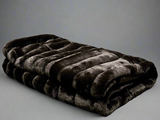 Ribbed Faux Rabbit & Velvet Blanket Collection by One Preevay Luxury Home Furnishings & Decor. Inspired by the regal Robe Royal, each hand-stitched piece features premium cruelty-free faux rabbit fur with elegant velvet underside, available in four luxurious colors: Elegant Black, Warm Beige, Classic Navy, and Dramatic Gray. Sizes: Twin (60" x 90"), Queen (90" x 90"). Hypoallergenic, soothing ribbed design for relaxation and easy care. Cruelty-free luxury, unmatched craftsmanship and detail in black