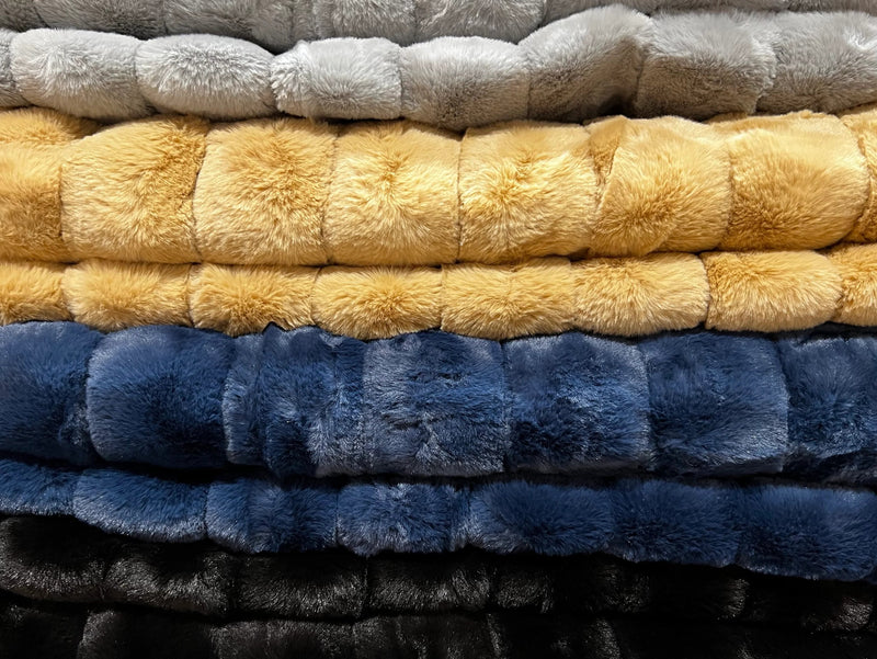 Ribbed Faux Rabbit & Velvet Blanket Collection by One Preevay Luxury Home Furnishings & Decor. Inspired by the regal Robe Royal, each hand-stitched piece features premium cruelty-free faux rabbit fur with elegant velvet underside, available in four luxurious colors: Elegant Black, Warm Beige, Classic Navy, and Dramatic Gray. Sizes: Twin (60" x 90"), Queen (90" x 90"). Hypoallergenic, soothing ribbed design for relaxation and easy care. Cruelty-free luxury, unmatched craftsmanship and detail and colors 