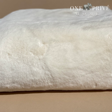  the One Preevay Faux Rabbit Fur Throw in Pure White. Inspired by the elegance of Fernando Botero and crafted from ultra-premium faux rabbit fur. Hypoallergenic, cruelty-free, over the sofa...