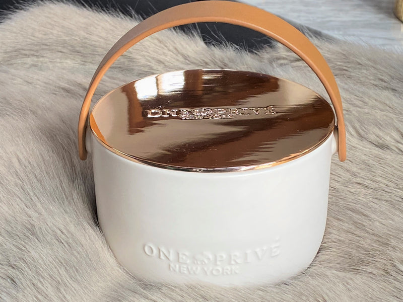 Discover the Grapefruit Neroli Perfumed Estate Candle from One Preevay. Handcrafted with premium essential oils and soy wax, it features a porcelain bowl with a silver-plated lid and leather strap. Enjoy the aromatic fusion of grapefruit and neroli. Order now to elevate your ambiance.
