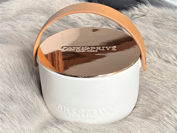 Discover the Lavender and Vanilla Perfumed Estate Candle from One Preevay. Handcrafted with premium essential oils and soy wax, it features a porcelain bowl with a silver-plated lid and leather strap. With a triple wick and 15.8 oz size, enjoy the aromatic blend of lavender and vanilla. Order now to elevate your ambiance.
