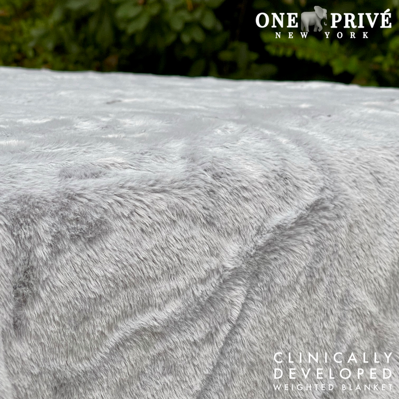 Experience luxurious relaxation with One Preevay's world's first weighted faux rabbit fur blanket, inspired by Fernando Botero. Clinically developed, 20lbs, hypoallergenic, and luxurious.....