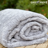 Experience luxurious relaxation with One Preevay's world's first weighted faux rabbit fur blanket, inspired by Fernando Botero. Clinically developed, 20lbs, hypoallergenic, and luxurious for serene sleep & relaxation...
