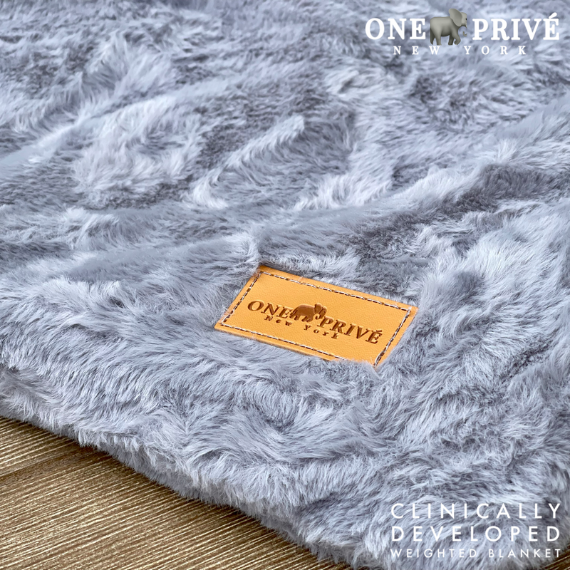 Experience luxurious relaxation with One Preevay's world's first weighted faux rabbit fur blanket, inspired by Fernando Botero. Clinically developed, 20lbs, hypoallergenic soft and plush 