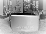 Indulge in the Bergamot and Clove Perfumed Estate Candle from One Preevay. Handcrafted with premium essential oils and soy wax, it features a stunning porcelain bowl with a silver-plated lid and leather strap. Elevate your ambiance with love