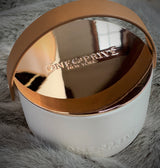Indulge in the Bergamot and Clove Perfumed Estate Candle from One Preevay. Handcrafted with premium essential oils and soy wax, it features a stunning porcelain bowl with a silver-plated lid and leather strap. Elevate your ambiance for a gift 