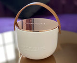 Indulge in the Bergamot and Clove Perfumed Estate Candle from One Preevay. Handcrafted with premium essential oils and soy wax, it features a stunning porcelain bowl with a silver-plated lid and leather strap. Elevate your ambiance with the best gift ever