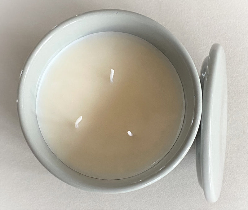 Indulge in the French Black Orchid Perfumed Estate Candle from One Preevay. Handcrafted with premium essential oils and organic soy wax, it features a pale gray ceramic vessel. With a triple wick and 21.2 oz size, enjoy the aromatic blend of blackberry, patchouli, and spices. Elevate your ambiance today with three wicks