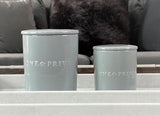 Indulge in the French Black Orchid Perfumed Estate Candle from One Preevay. Handcrafted with premium essential oils and organic soy wax, it features a pale gray ceramic vessel. With a triple wick and 21.2 oz size, enjoy the aromatic blend of blackberry, patchouli, and spices. Elevate your ambiance today for months 